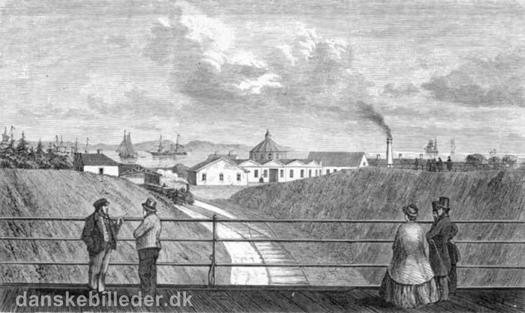 Udsigt fra Frederiksbroen mod Aahus Banegård i 1862.